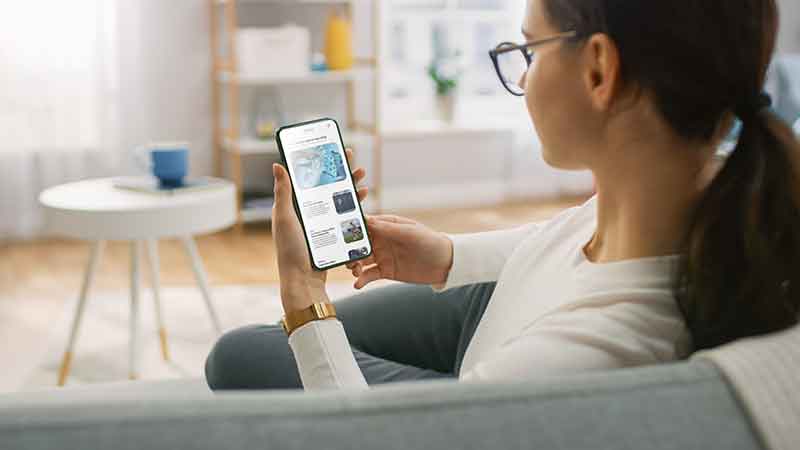 https://www.shutterstock.com/image-photo/young-woman-home-uses-smartphone-scrolling-1833205213